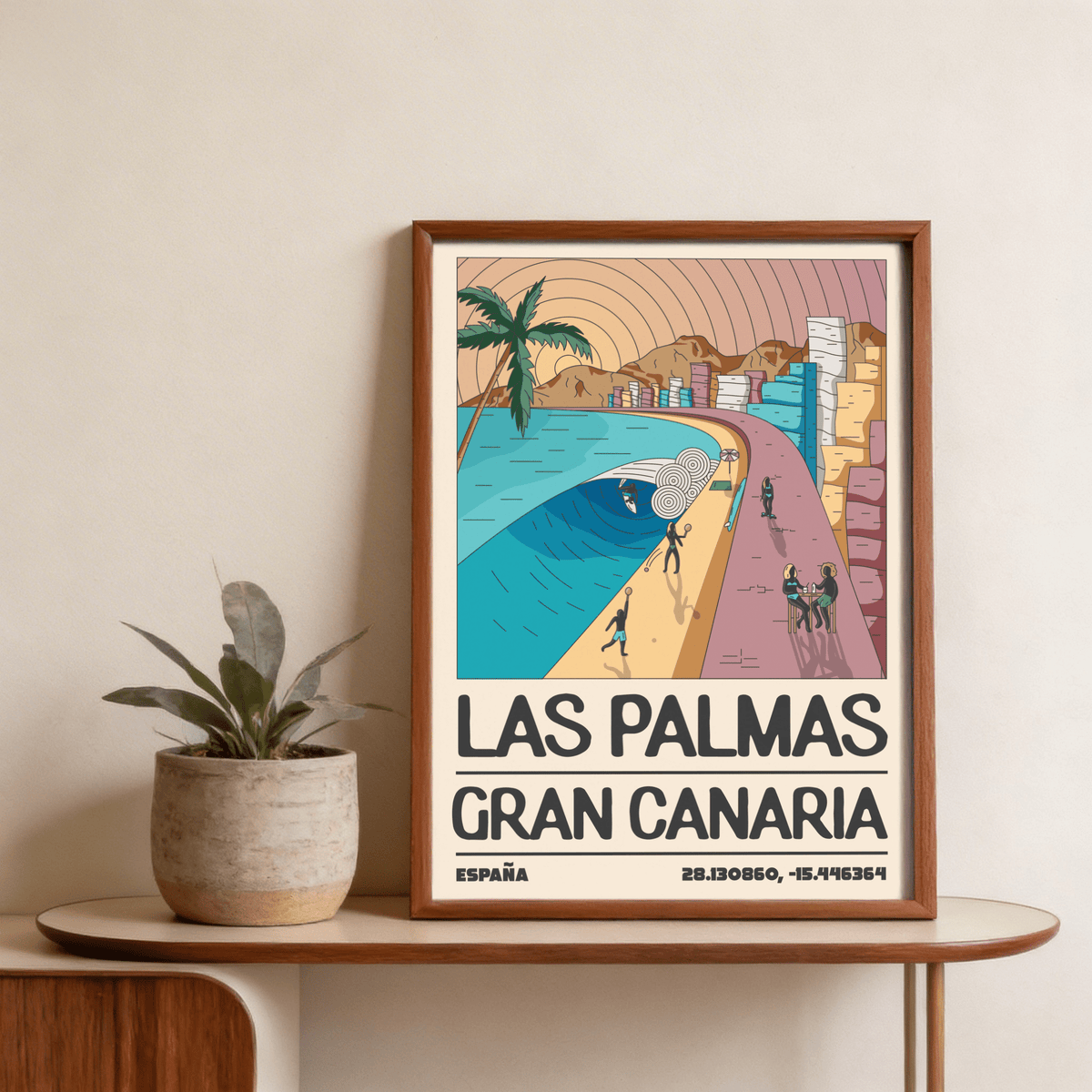 Framed Las Palmas Art Print of a retro beach scene with blue waves and buildings on a shelf next to a plant