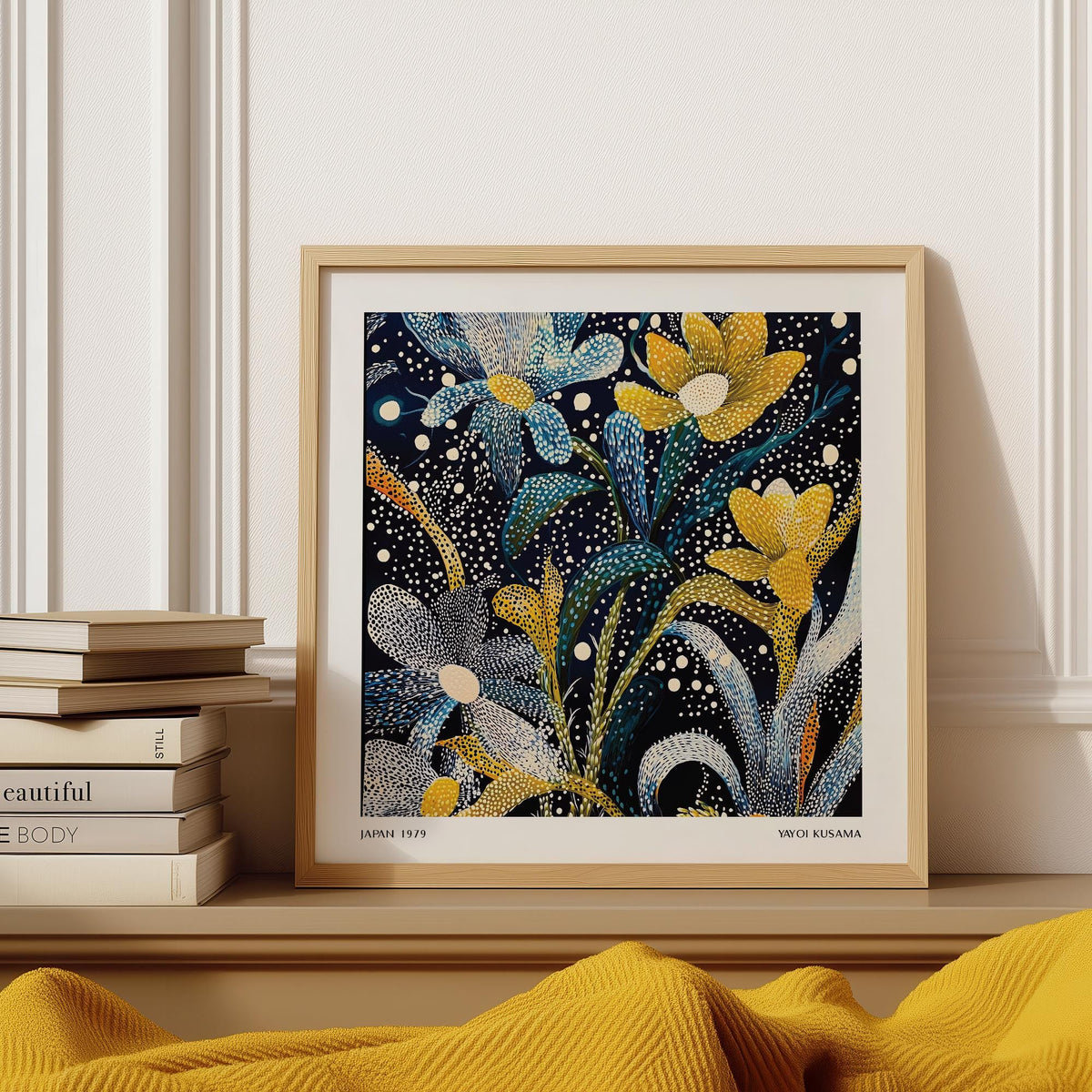 Framed Dark Floral Wall Art with blue yellow and white abstract flowers on a shelf with books
