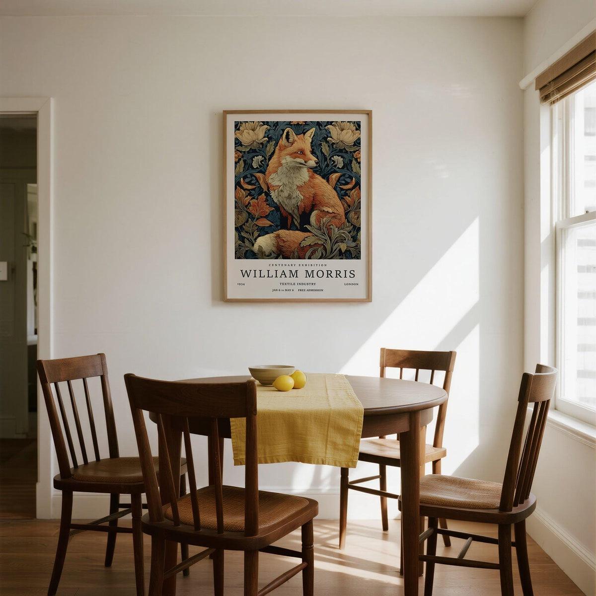 William Morris Fox Print on a white wall above dining table with wooden chairs and a yellow runner
