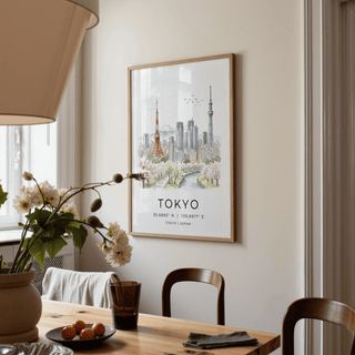 Tokyo Skyline Art Print hanging on a beige wall with a wooden frame above a dining table