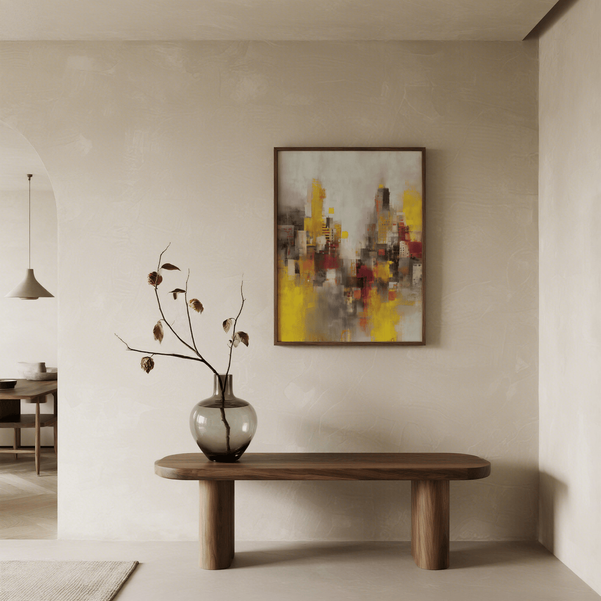 Abstract Cityscape Art Print on a wall in a neutral beige room above a wooden bench with a large vase and dried branches