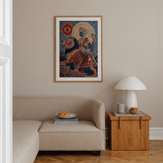 Indian Warrior wall art with a blue-skinned woman riding a lion above a beige sofa