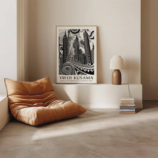 Print leaning on a shelf of New York Cityscape wall art with Statue of Liberty in black and white next to a lamp
