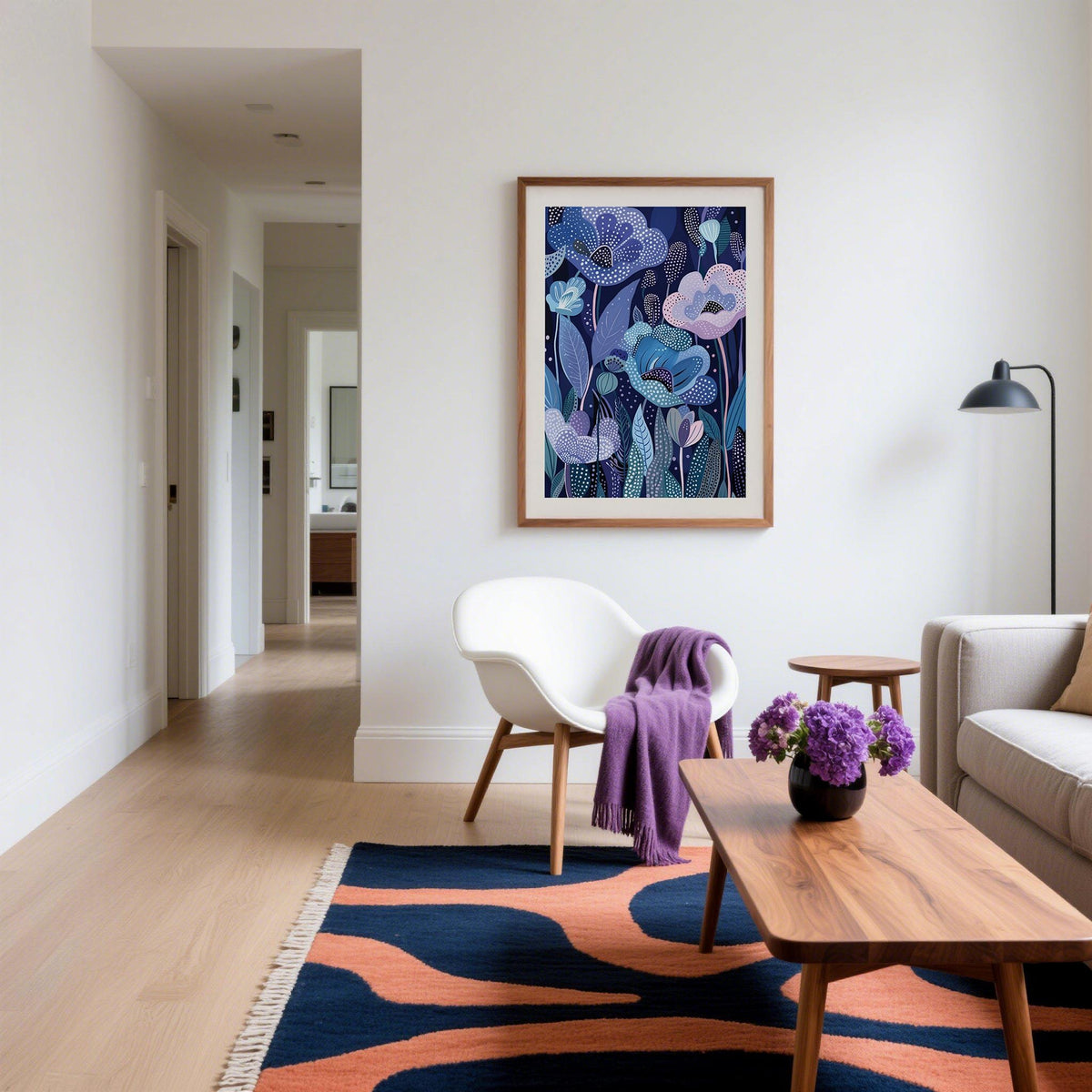 Purple home decor wall art with abstract lavender flowers above a white chair in a living room