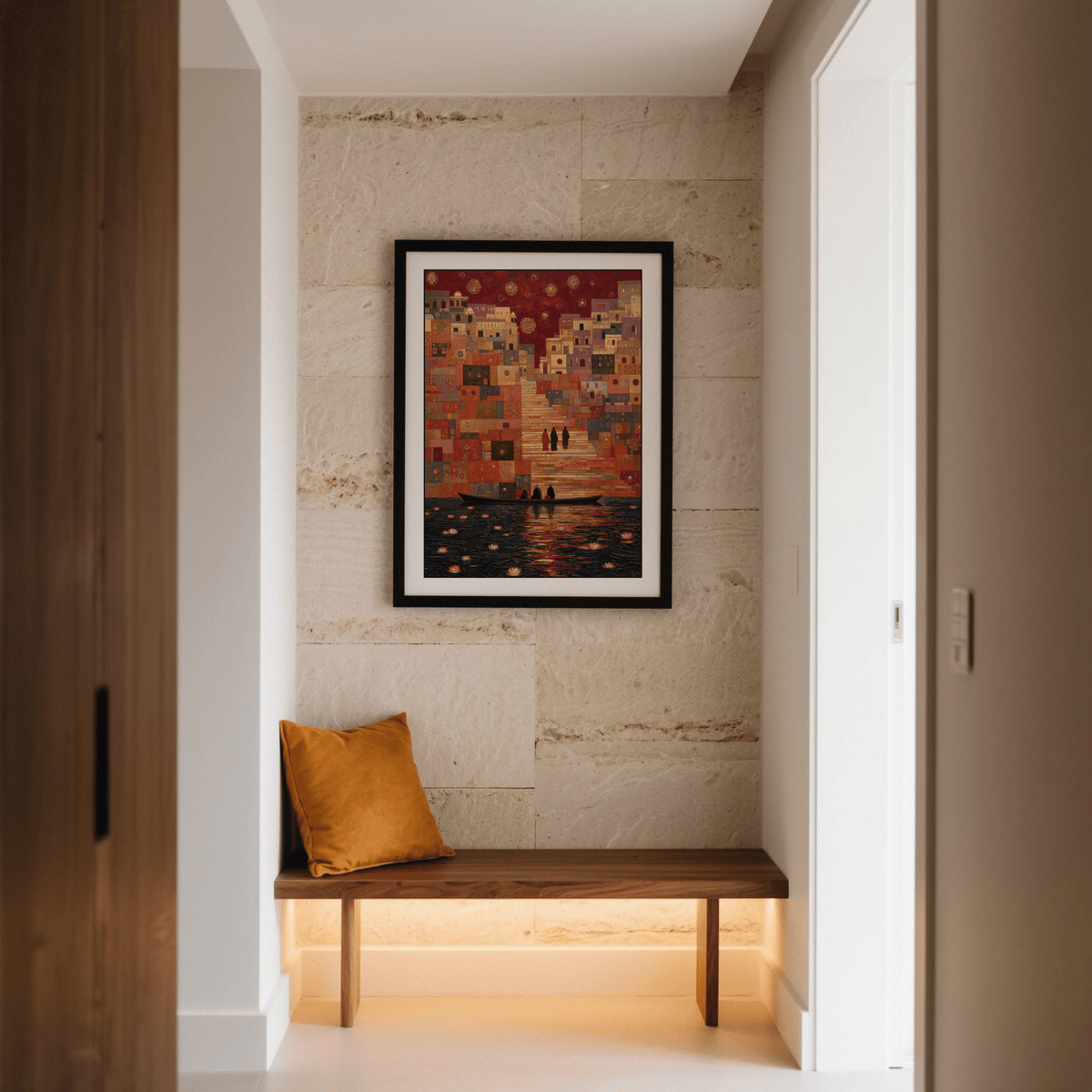 Framed Varanasi art print with rich reds and oranges above a wooden bench with an orange cushion