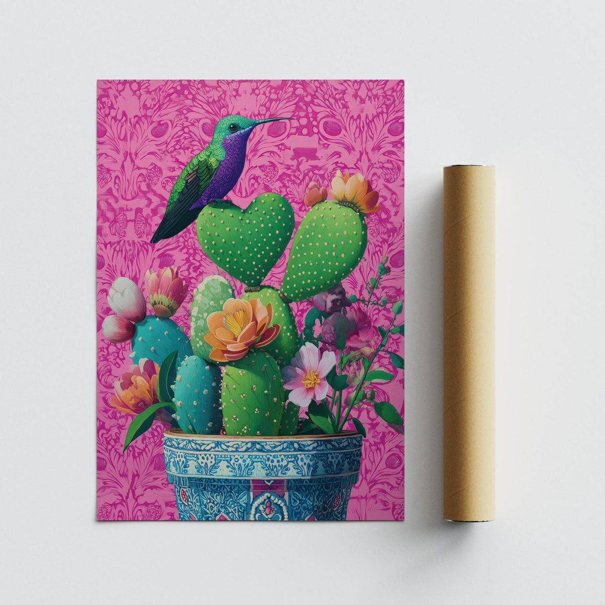 Heart Shaped Cactus wall art of a hummingbird on green cacti with a pink background next to a packaging tube