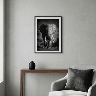 Wildlife Photography Art showing an elephant with large tusks in black and white above a wooden console with a black vase