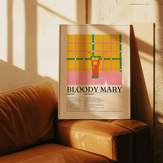 Framed Retro Drink Poster with bloody mary cocktail illustration resting on a tan leather sofa