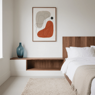 Simple Abstract Art print with beige and rust shapes above a wooden shelf and blue vase in bedroom