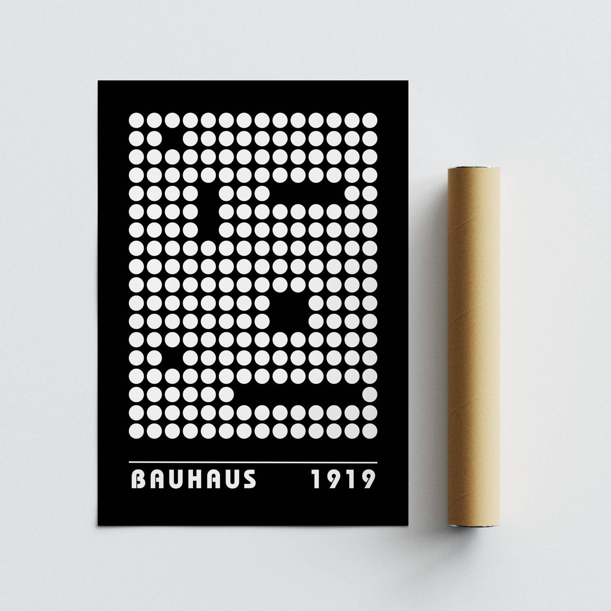 Digital wall art abstract dot pattern in black and white with minimalist style lying flat with a brown packaging tube