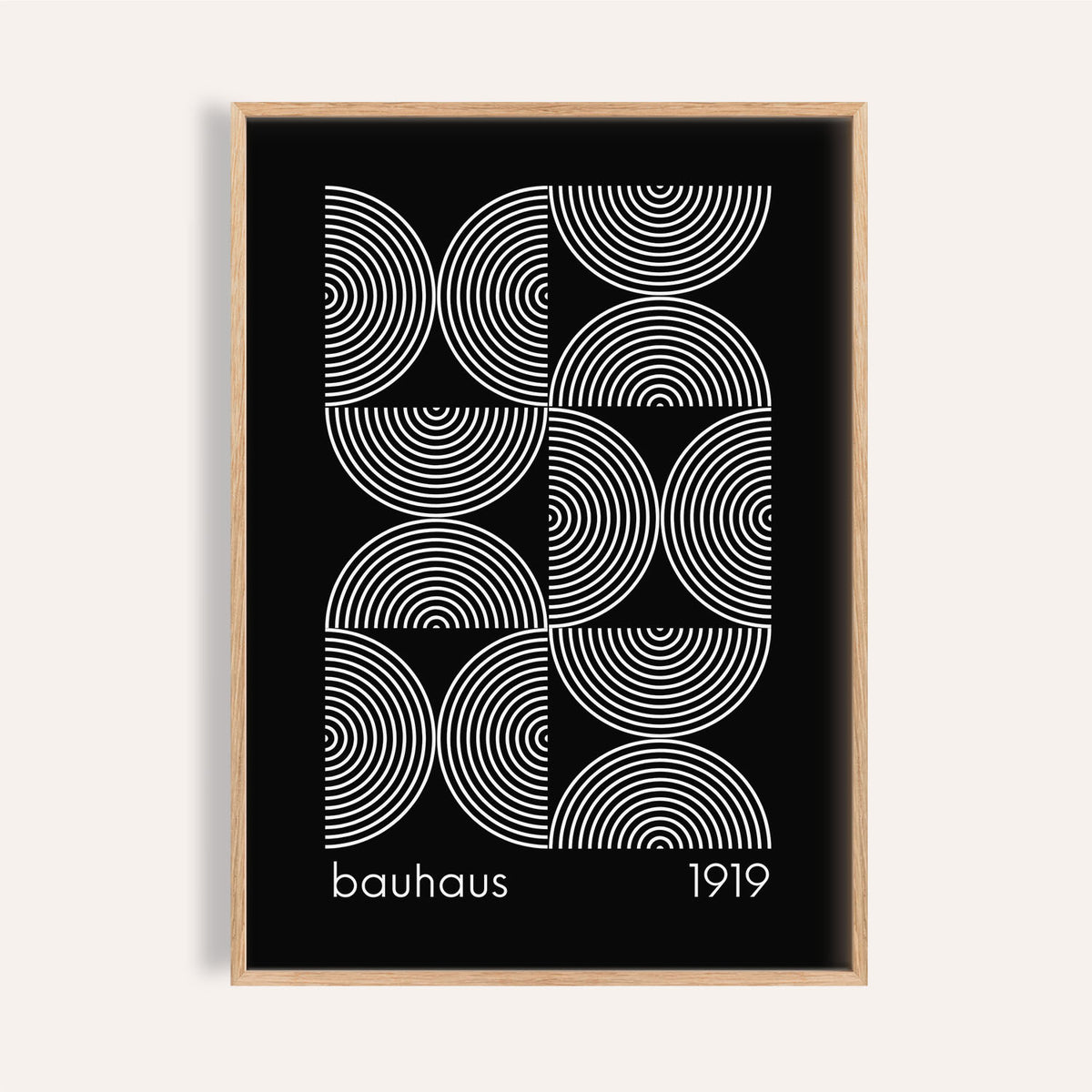 Framed Geometric Wall Art with white concentric circles on a black background in a minimalist style