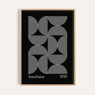 Framed Geometric Wall Art with white concentric circles on a black background in a minimalist style