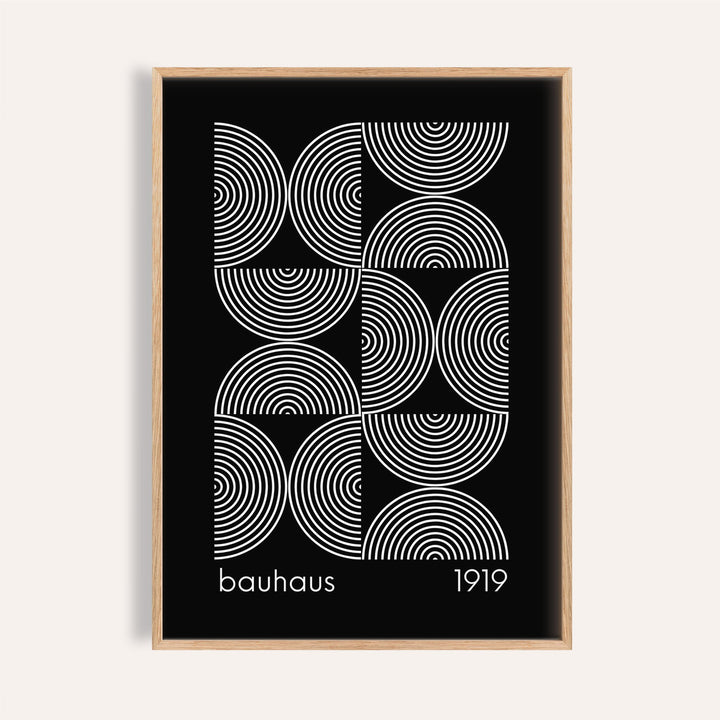 Framed Geometric Wall Art with white concentric circles on a black background in a minimalist style