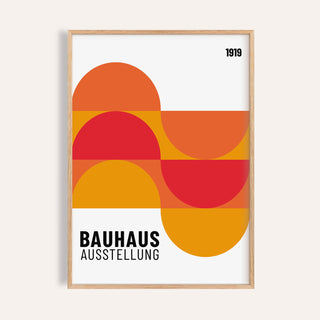 Framed Inexpensive Artwork with abstract geometric shapes in orange and red on white background