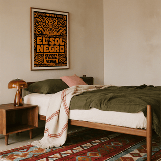 Mexican Culture Art Print framed on wall above bed with olive green bedding and woven rug