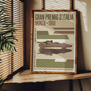 Print leaning on a shelf of Monza Grand Prix Poster in green and brown tones with a leafy plant nearby
