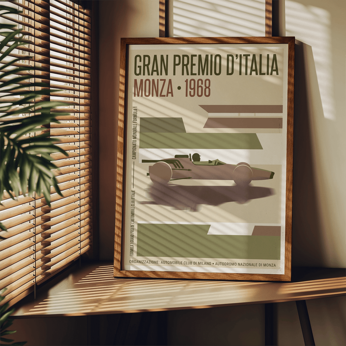 Print leaning on a shelf of Monza Grand Prix Poster in green and brown tones with a leafy plant nearby