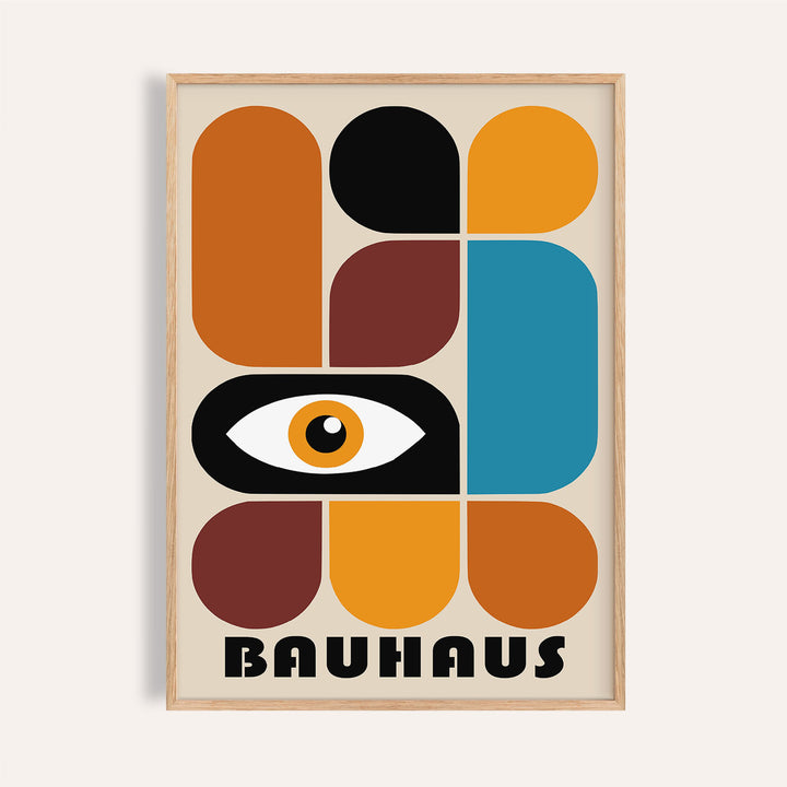 Framed geometric shapes wall art with abstract eye and bauhaus text in warm tones