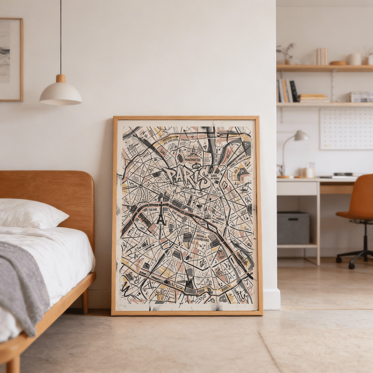 Print leaning on floor of Paris map art print with beige and black tones near wooden bed