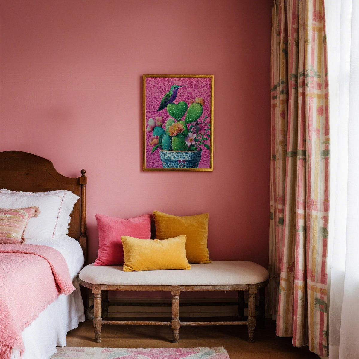 Heart Shaped Cactus wall art with green cacti and a hummingbird above a bench with cushions in a pink bedroom