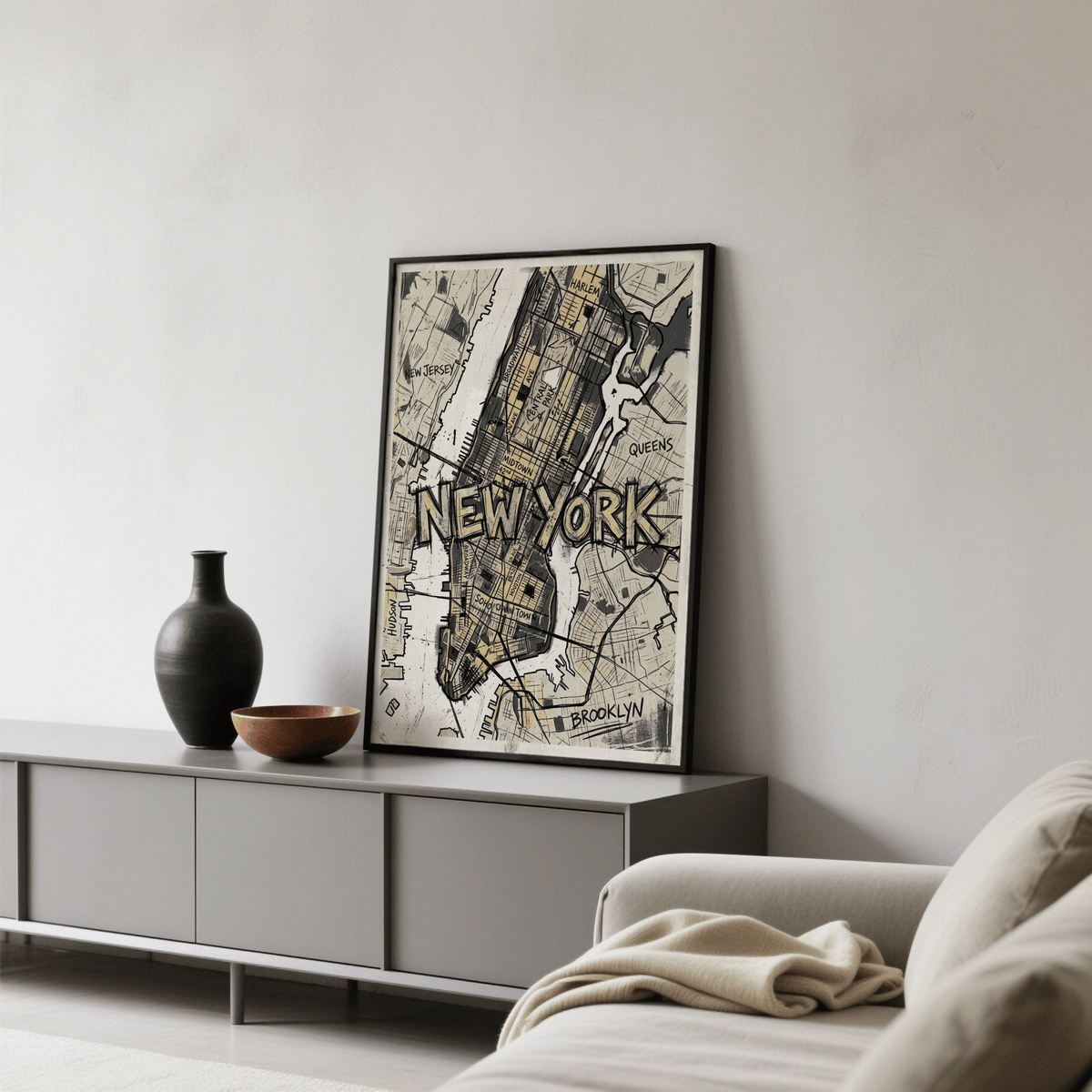 Print leaning on a shelf New York Map Art in black and beige tones with a vase nearby