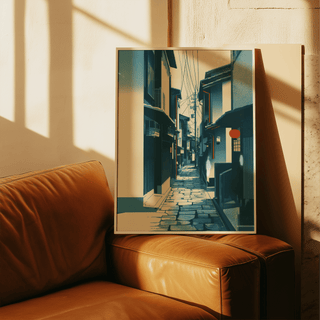 Japanese Street wall art in a frame leaning on a brown leather sofa with sunlight shadows