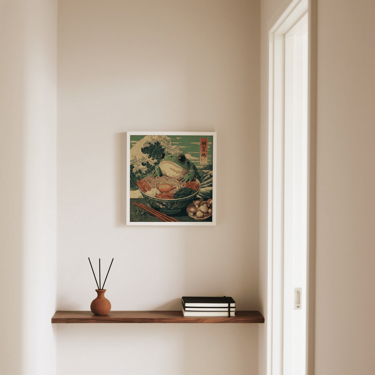 Frog Ramen Art print with green and beige tones above a shelf holding a vase with sticks