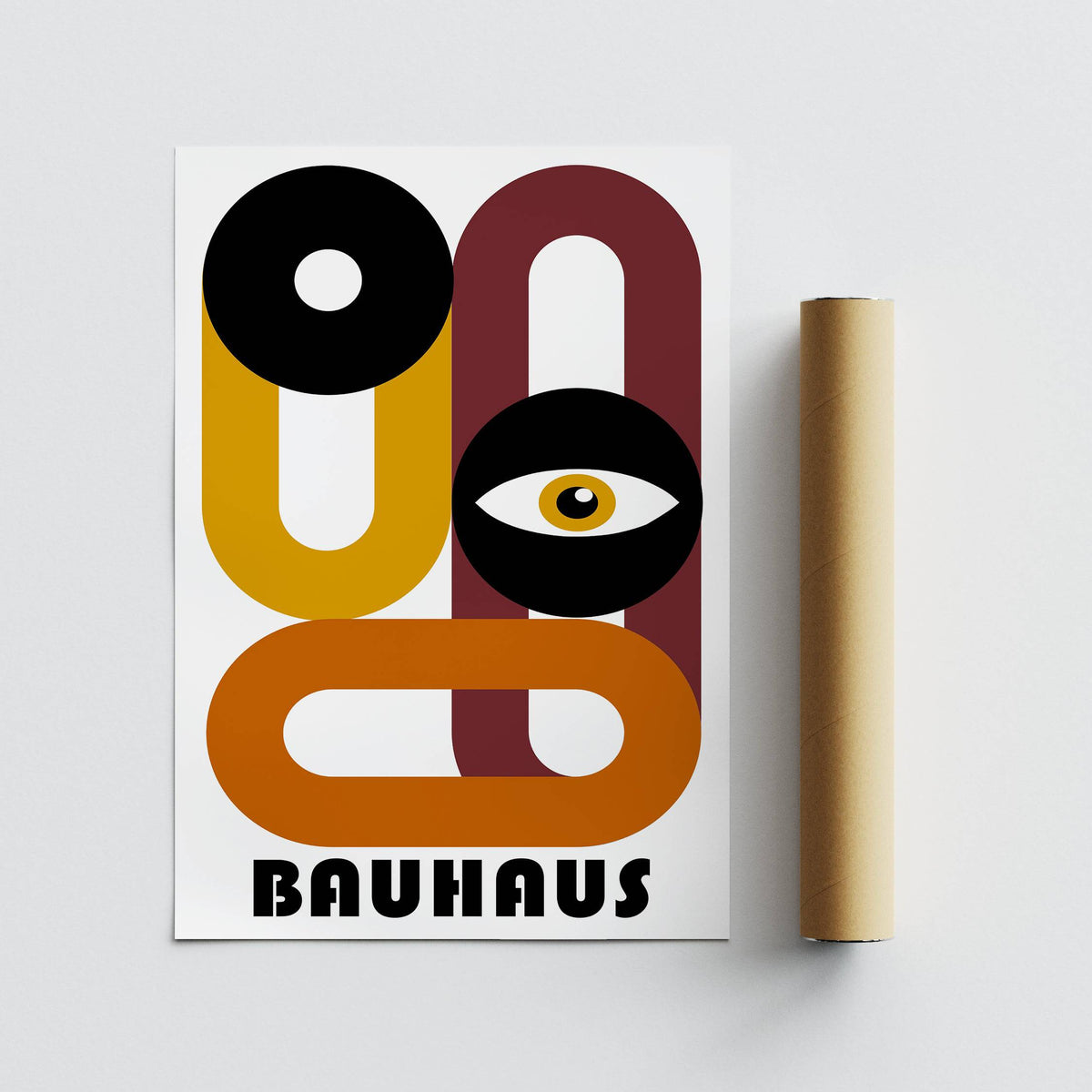 Retro Home Decor print with an abstract eye and geometric shapes in mustard, black, and rust next to a rolled packaging tube