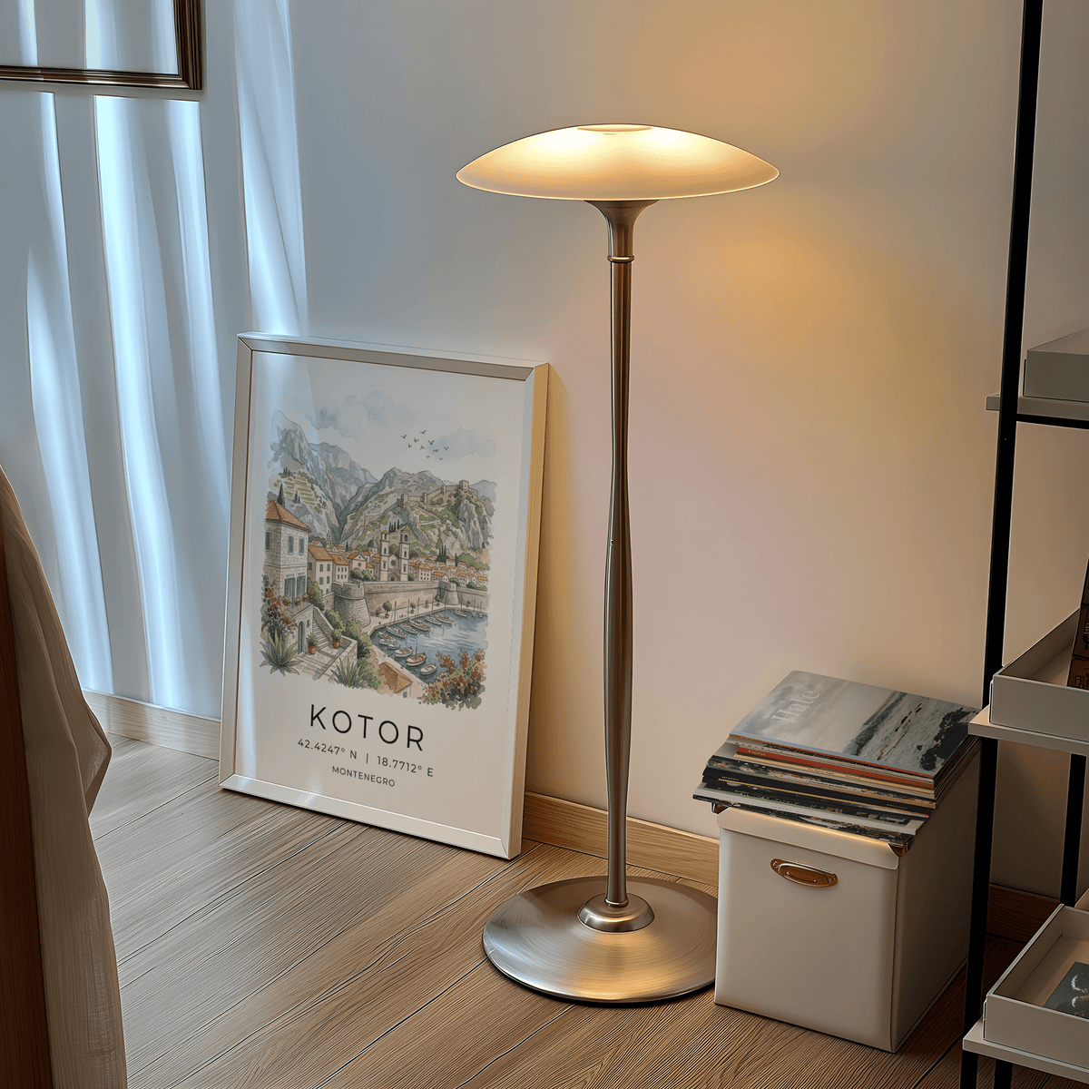 Print leaning on the floor of Kotor landscape art print with watercolour townscape near a lit lamp