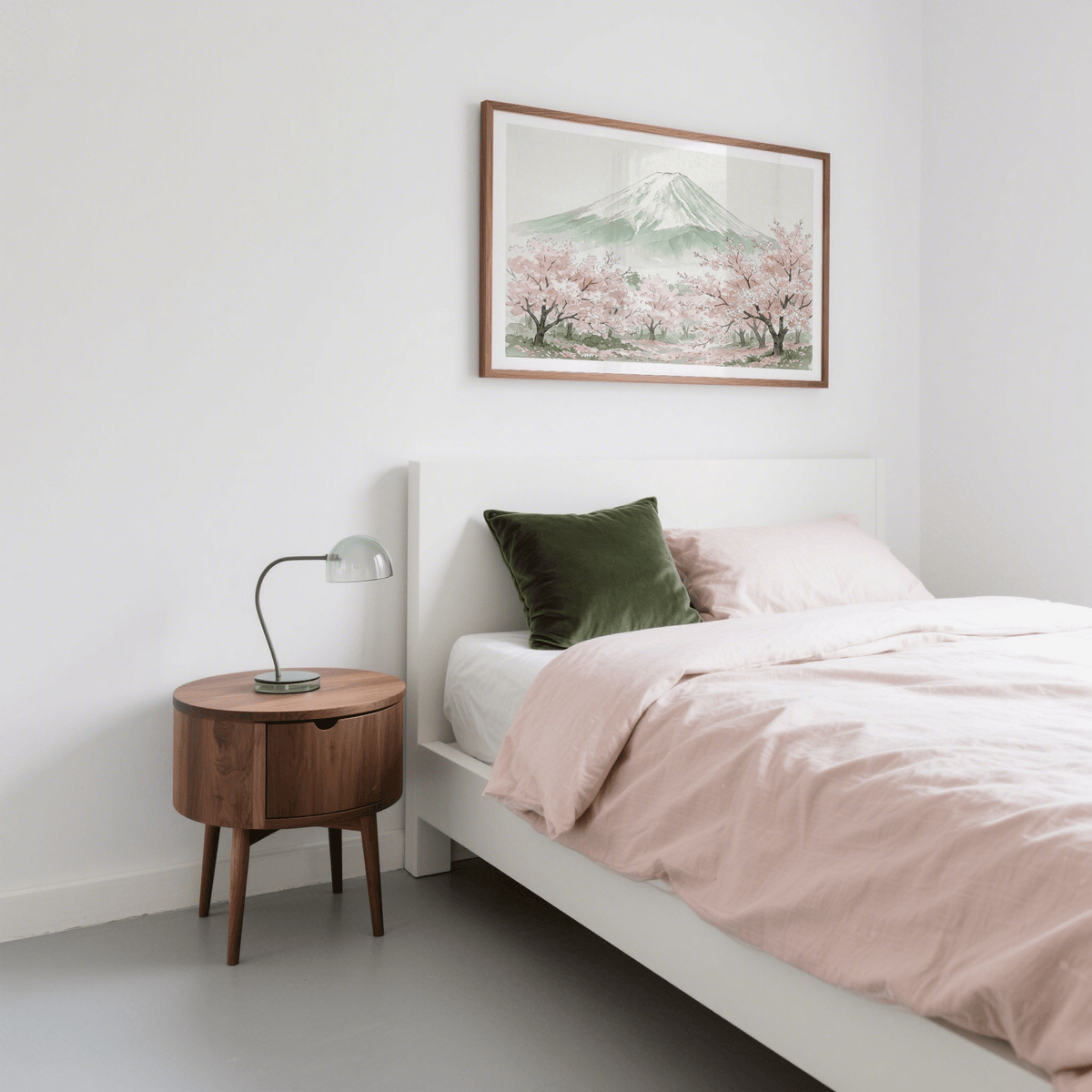 Mount Fuji print with watercolour cherry blossoms in pink and green above a wooden bedside table