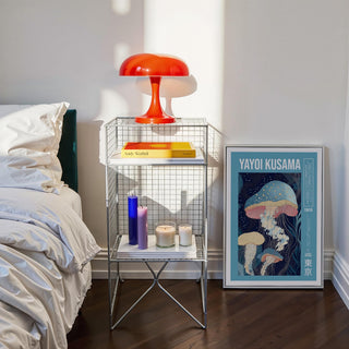 Unique Art Prints framed print of blue and pink jellyfish leaning against wall next to bedside table with red lamp