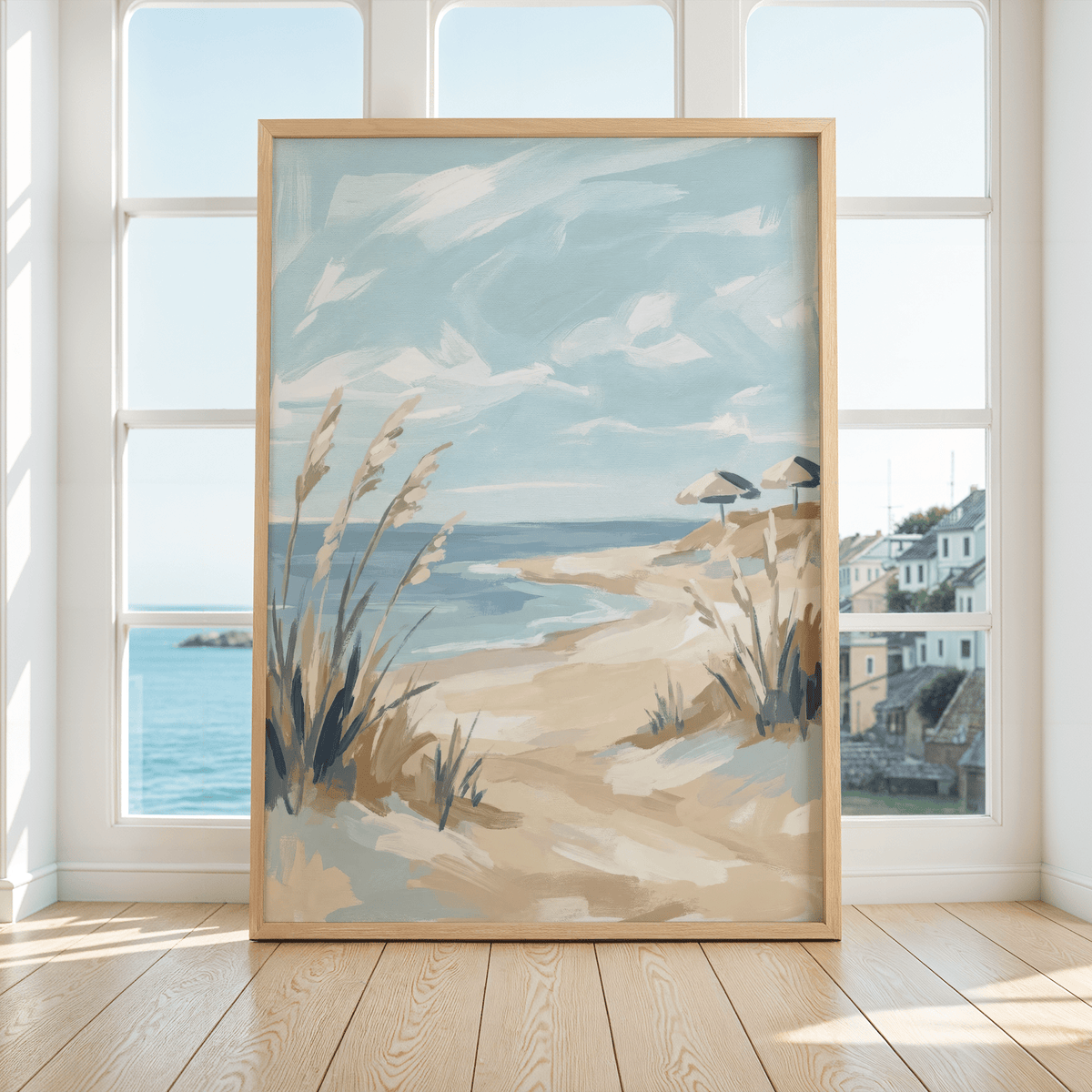 Beach landscape art print of a sandy beach with umbrellas in a sunlit room by large windows