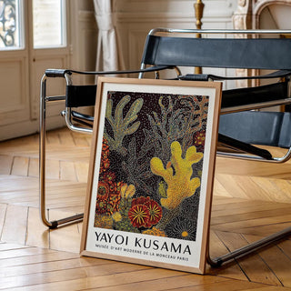 Coral Reef Art Abstract print leaning on the floor by a black metal chair in a classic room
