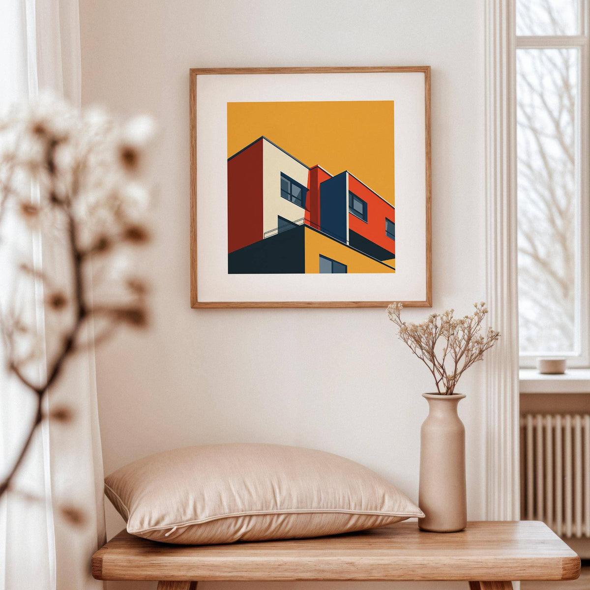 Bauhaus Architecture Print framed on a wall with a beige cushion and vase on a wooden table