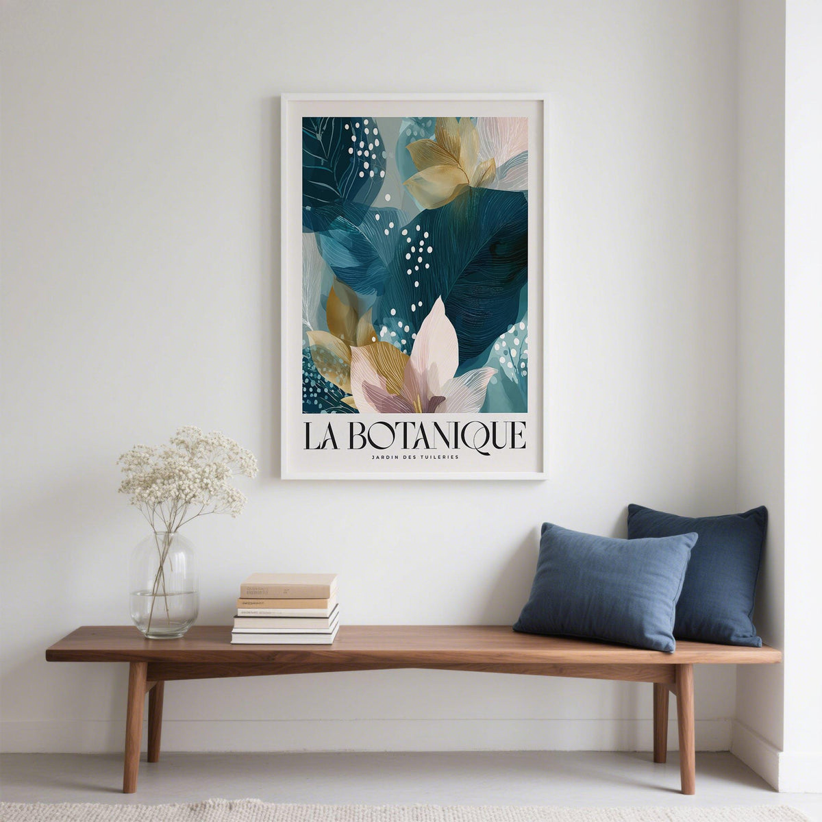 Botanical artwork print of blue leaves and flowers above a wooden bench with cushions
