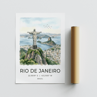 Rolled print next to Cristo Redentor Poster in watercolour with blue sky and cityscape