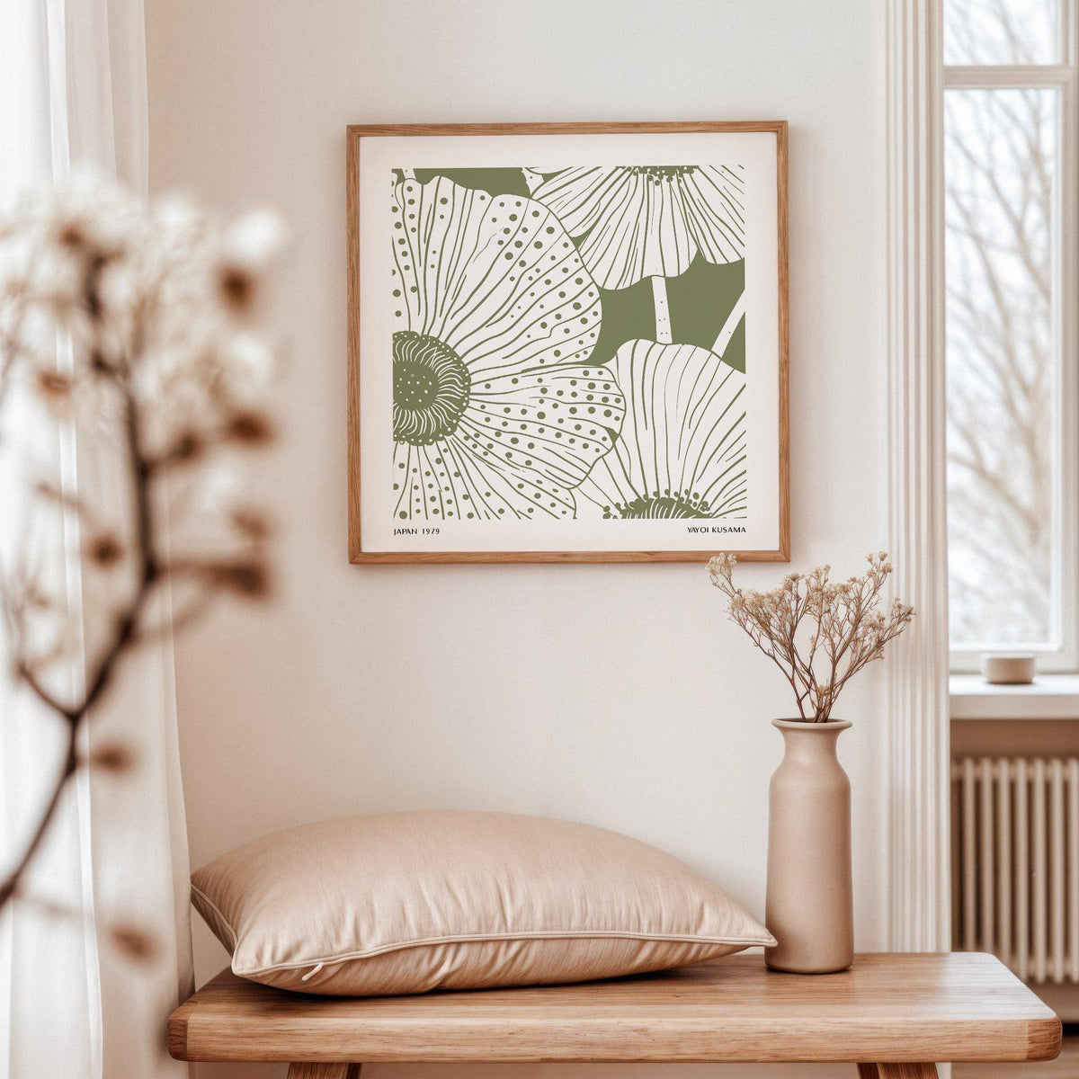 Sage Green Abstract Wall Art with minimalist floral illustration above a wooden bench with a cushion and vase