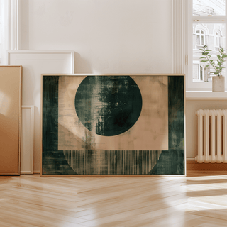 Abstract geometric poster leaning against a wall near a window letting in natural light