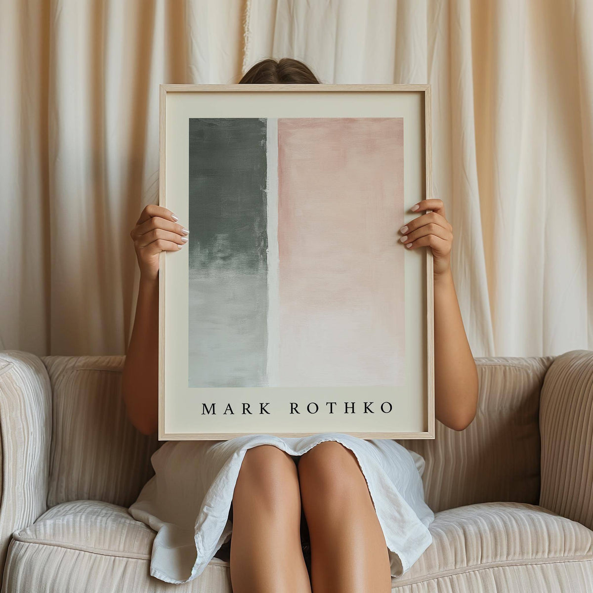 Framed Art Wall Painting with grey and pink abstract pastel blocks held by person on beige sofa