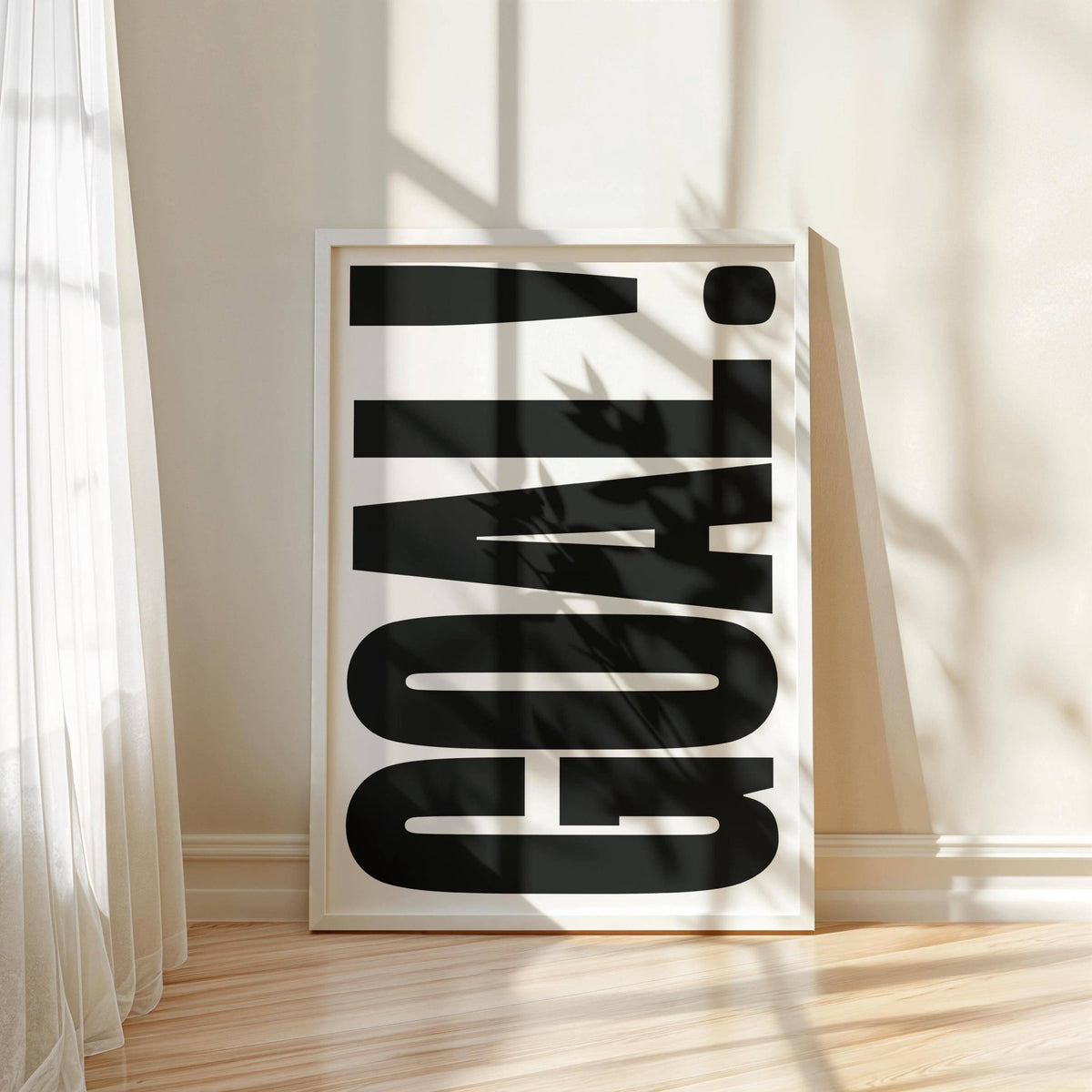 Wall Art for Games Room with GOAL typography print leaning against a white wall in natural light