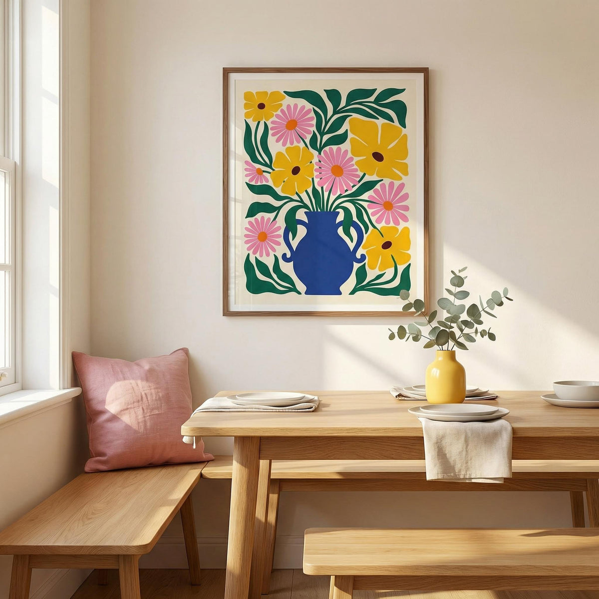 Floral Vase Art Print on a dining room wall with a wooden table and a yellow vase with leaves