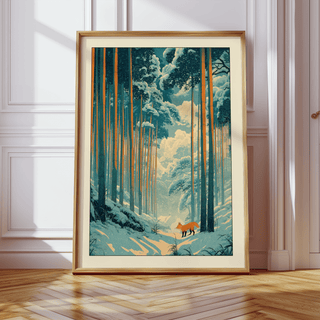 Japanese Fox Woodblock Print framed print of a red fox in a snowy forest with tall trees leaning against a wall