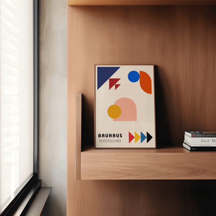 Abstract Geometric Art print leaning on a wood shelf with books nearby in a softly lit room
