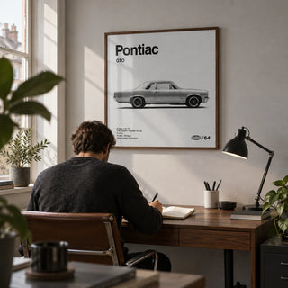 1960s Muscle Car Wall Art, framed on the wall of a car enthusiast's home study in a UK terraced house with a pale grey wall