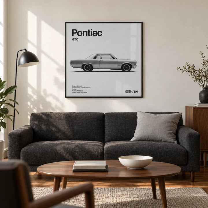 1960s Muscle Car Wall Art, framed on the wall of a mid-century inspired living room in a UK flat with a warm white wall and walnut floor