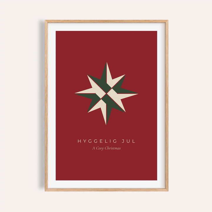 Red paper star Christmas print shown on a plain warm wall