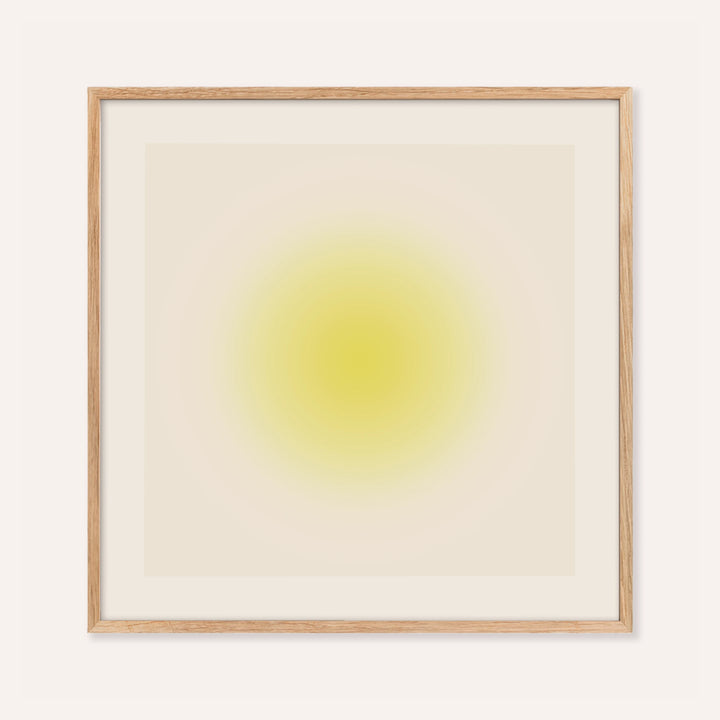 Yellow wall art with a soft butter yellow orb on a warm cream square
