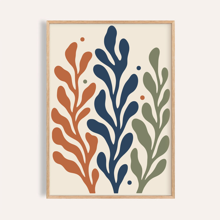 Seaweed print with three tall fronds shown on a plain warm wall