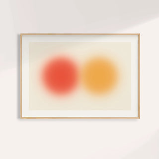 Abstract sun wall art with a red orange orb beside an amber orb on cream