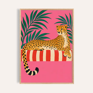 Cheetah Siesta poster with a cheetah lounging on a striped day bed on pink